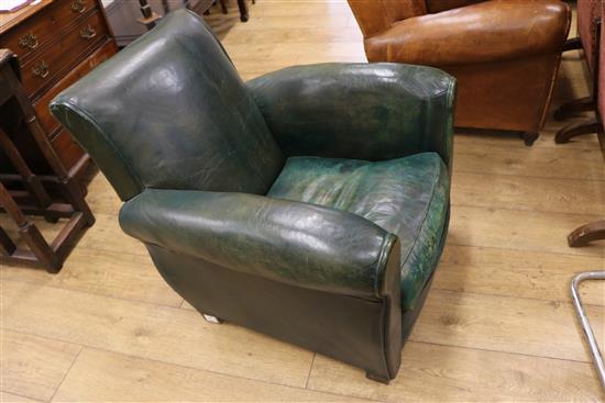 A 1930s French green leather armchair